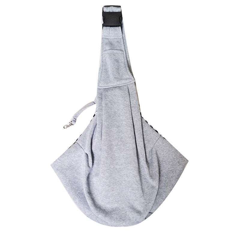 Adjustable Dog Out Pet Bag in light gray soft polyester with a sling-style shape, wide shoulder strap, and safety leash clip