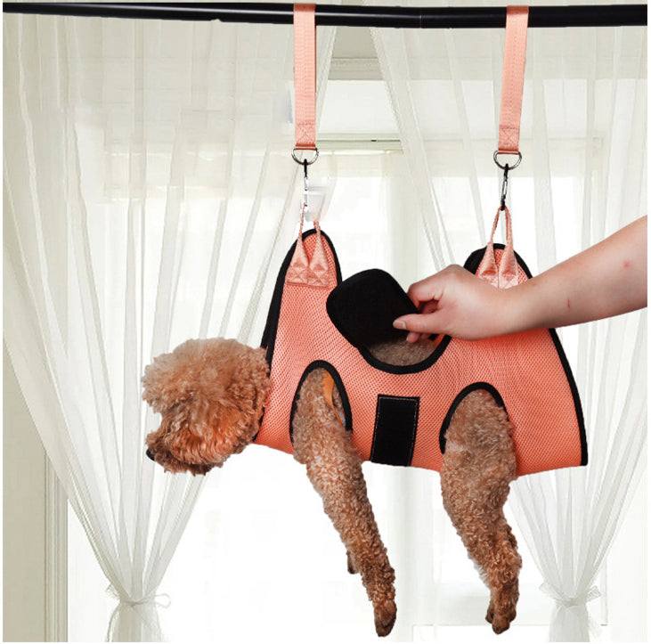 Cat Grooming Nail Cutting hammock in coral mesh fabric with black trim, leg openings and adjustable hanging straps