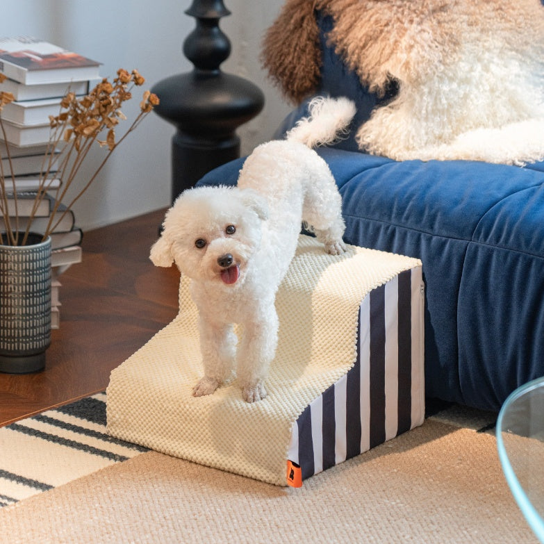 Dog Stairs Bed featuring cream textured fabric on steps with navy and white striped sides, designed for small dogs