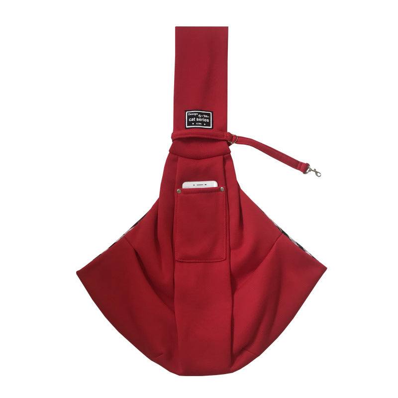Pet Dog Travel Sling in deep red soft fabric, with a front phone pocket, wide pouch, and adjustable strap