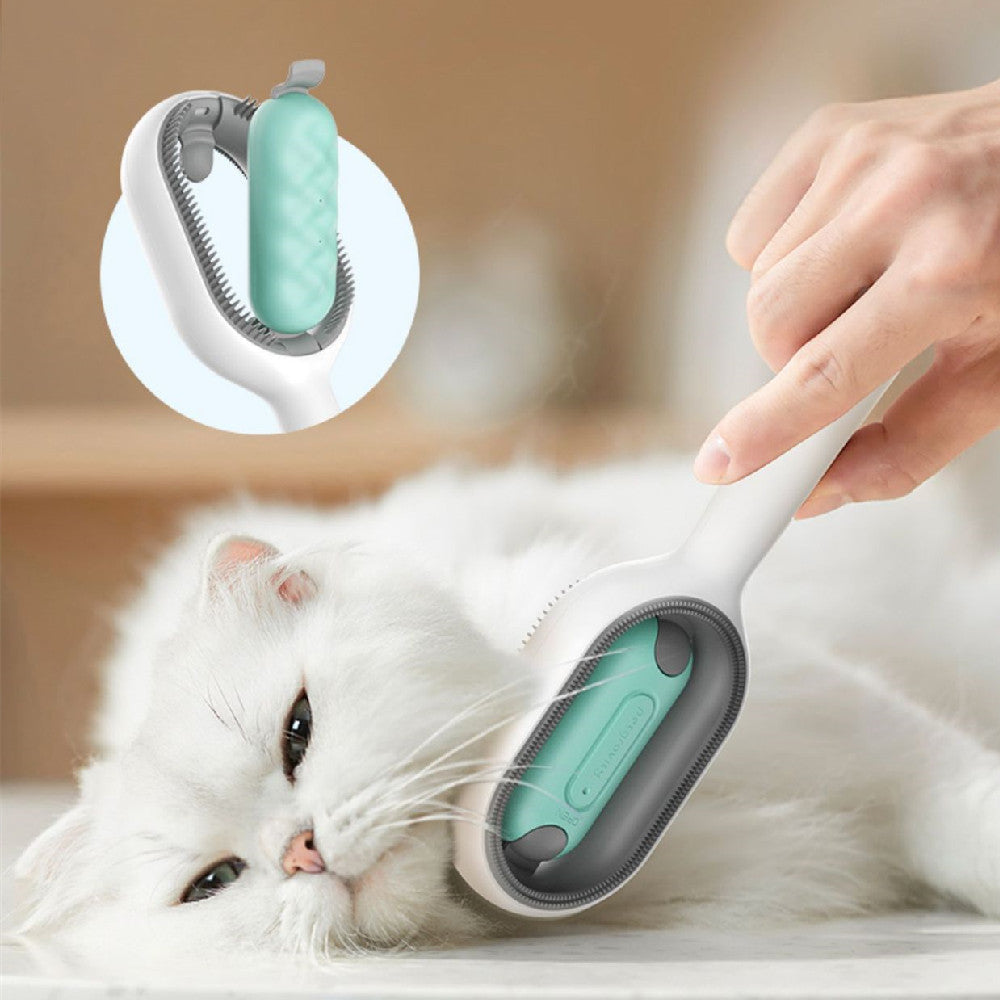 Pet Grooming Brush in white and teal with soft silicone bristles, shown grooming a fluffy white cat relaxed on a surface