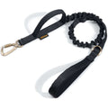 Traction Rope Collar in black nylon webbing with a coiled shock-absorbing section, padded handle and metal clips